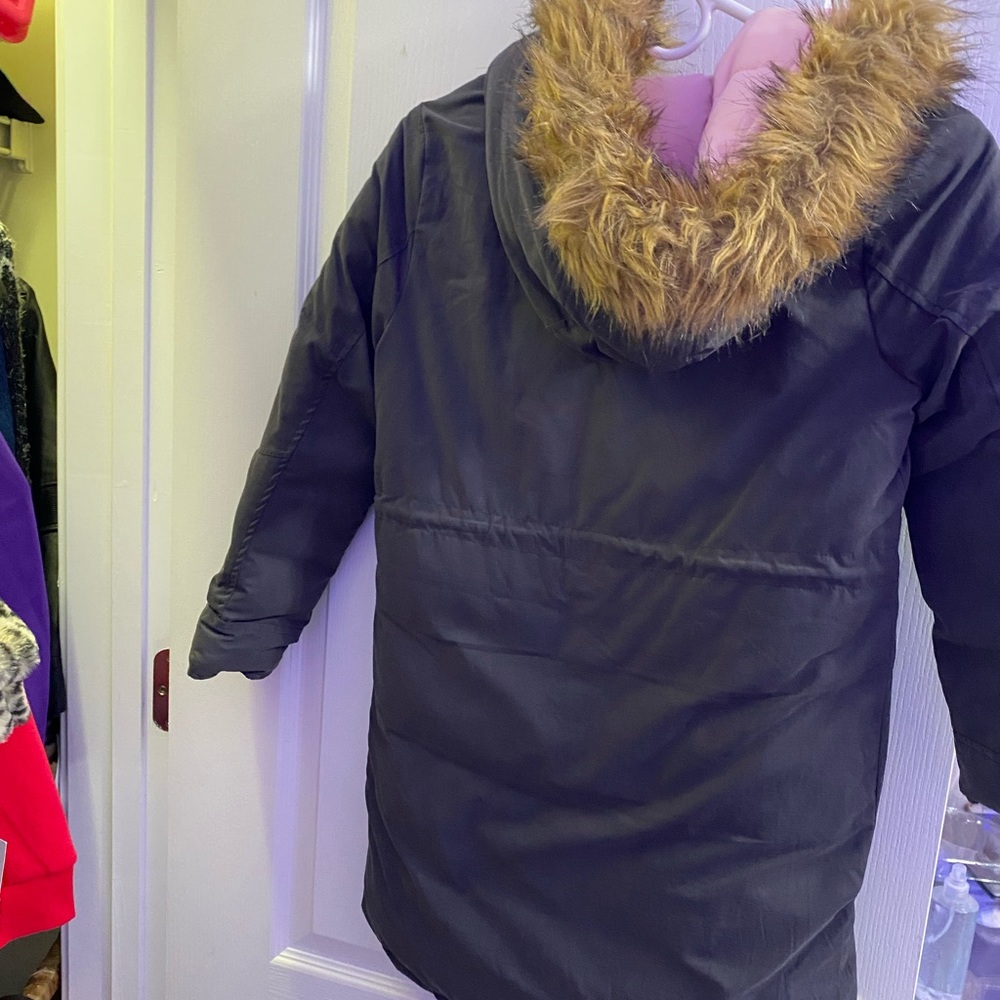Reversible winter coat with faux fur trim hood.